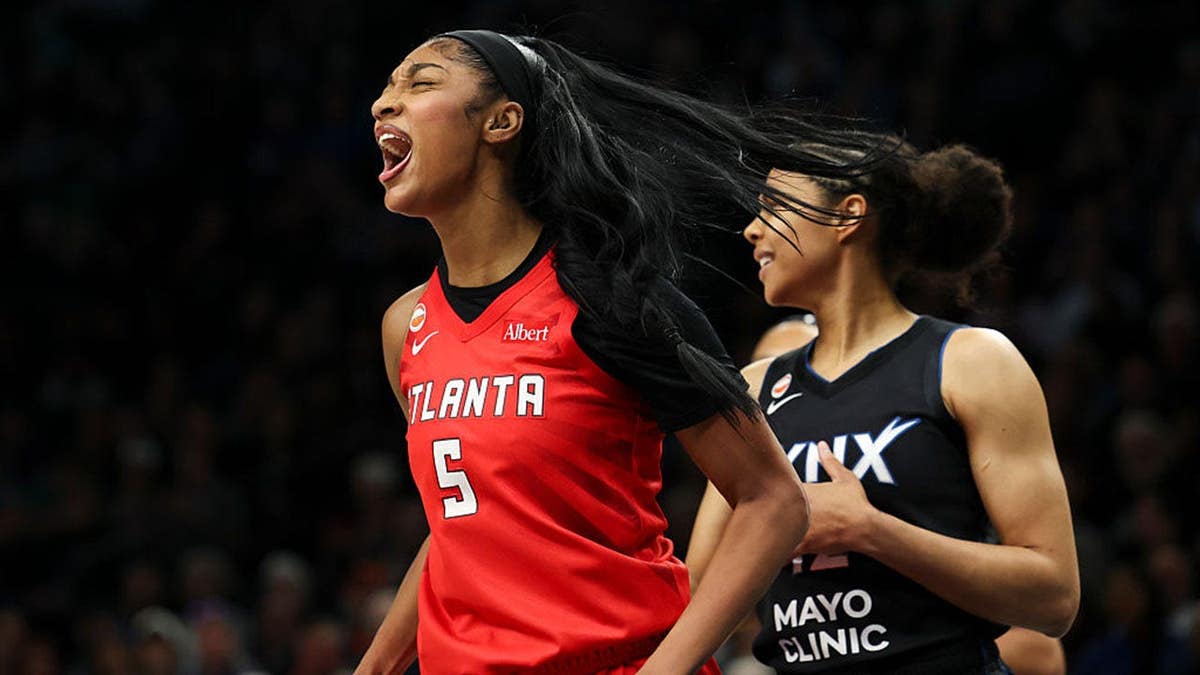 Angel Reese in Atlanta Dream jersey, mid-game scream