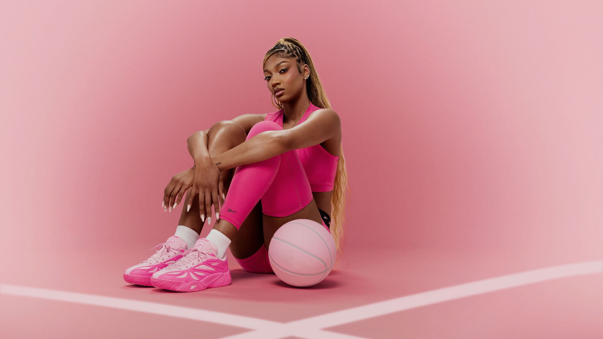 Angel Reese in all-pink Reebok shoot featuring her AR1 signature shoe